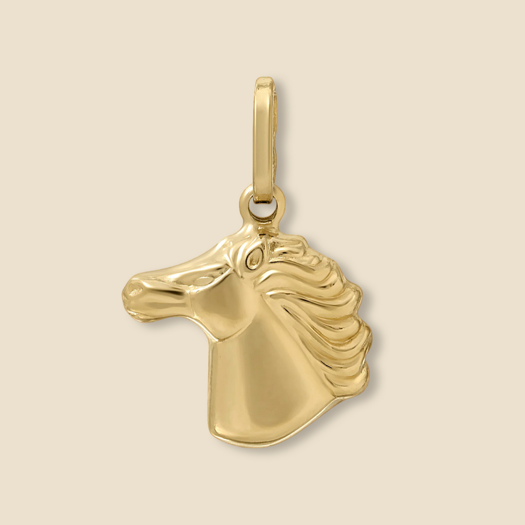 Solid 14K yellow gold horse head charm on a plain background, showing polished finish.