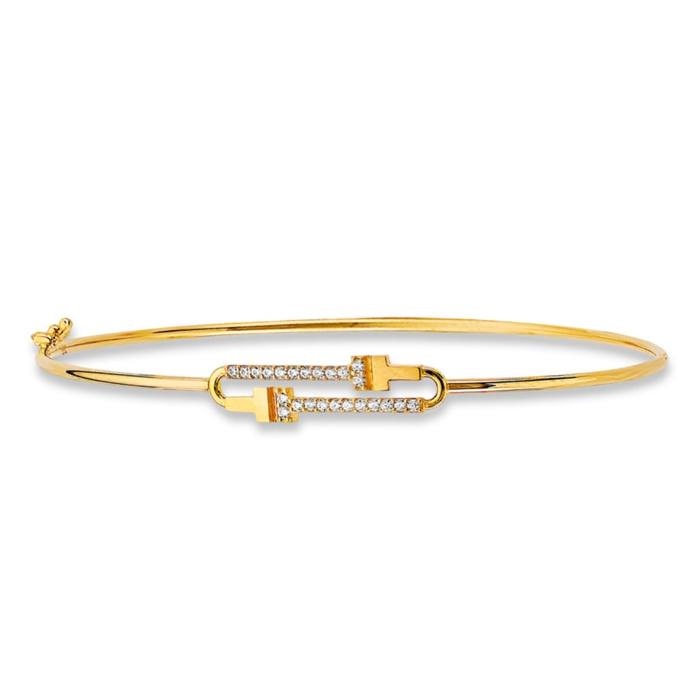 14K yellow gold flexible bangle with cubic zirconia stones, displayed on a white background to highlight its lightweight and elegant design.