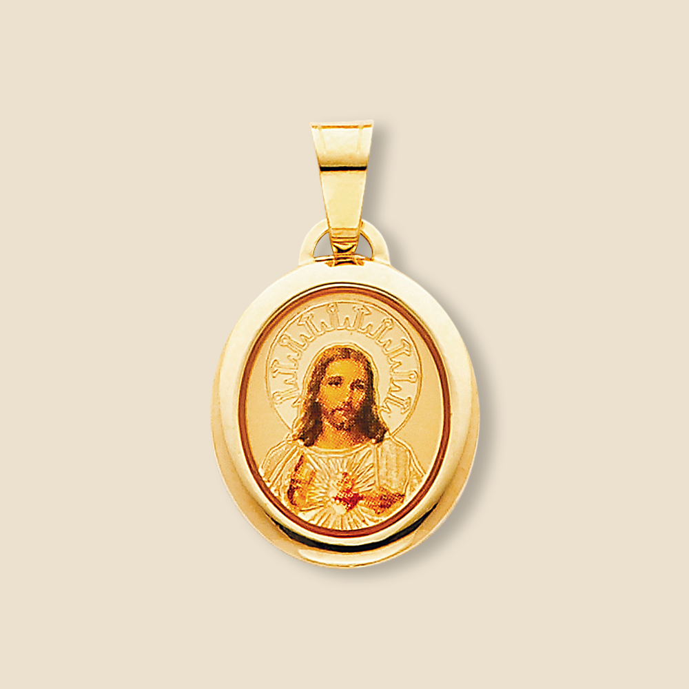 14K gold Sacred Heart of Jesus pendant shown against a plain background to highlight its red enamel and polished finish.
