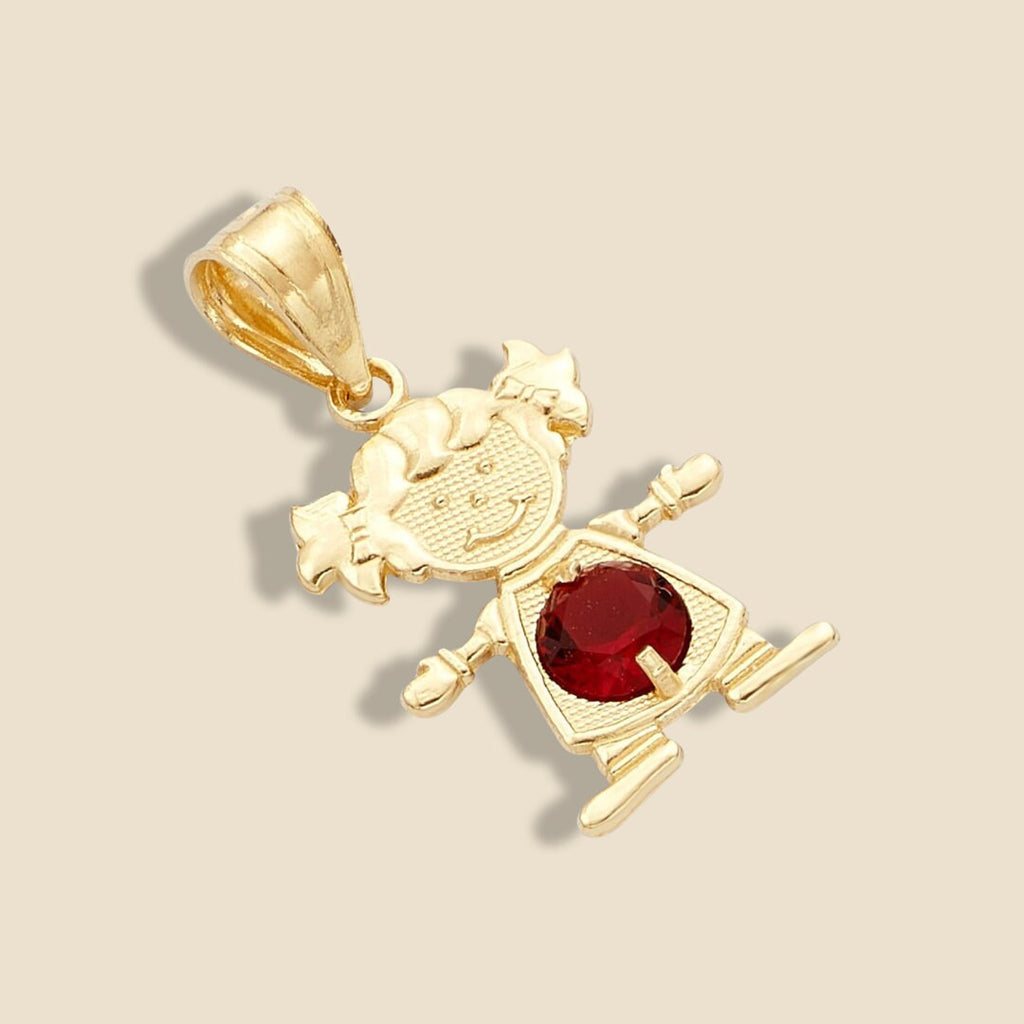 14K Gold Girl Charm with red cubic zirconia birthstone, resting on a plain background to showcase its radiant shine and intricate details.