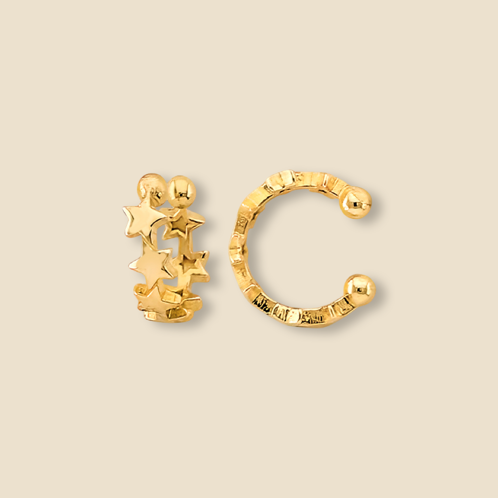 Polished 14K yellow gold star ear cuff shown on a plain background, emphasizing its minimalist celestial style.