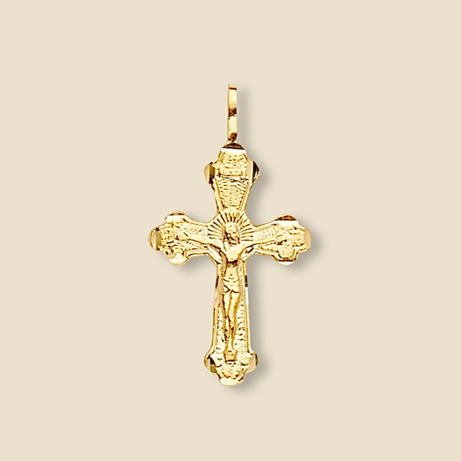 14K gold crucifix pendant displayed on a plain background, emphasizing its clean lines, spiritual design, and polished gold finish.