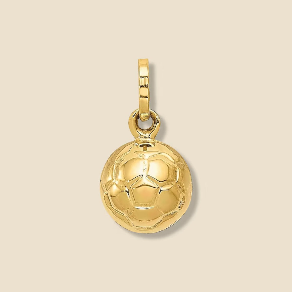 Floating 14K real gold soccer ball pendant on a plain background, showcasing polished surface and dimension.