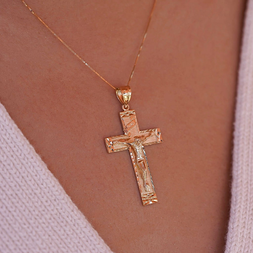 Model wearing the 14K Yellow Gold Fancy Crucifix Pendant, showcasing its intricate design and religious symbolism.