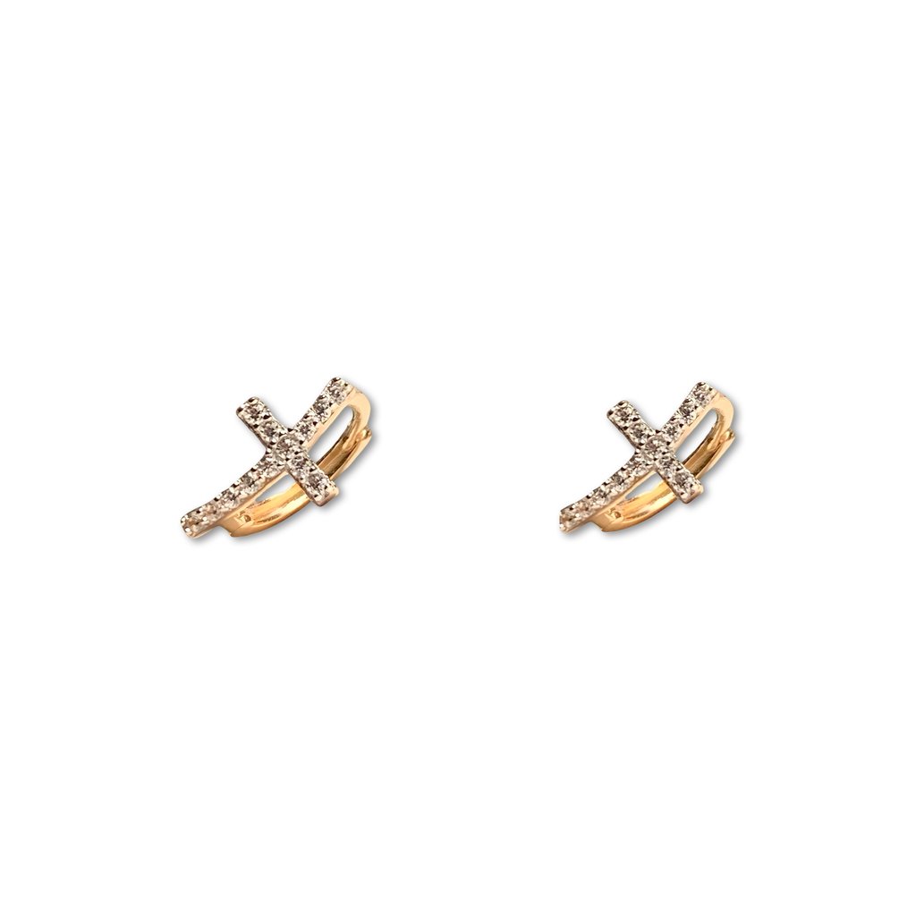 14K solid gold curved CZ cross Huggies earrings on a plain background, showing the 10mm × 7mm design and sparkling CZ details.