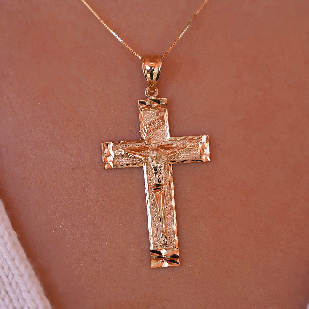 Model wearing the 14K Yellow Gold Fancy Crucifix Pendant, showcasing its intricate design and religious symbolism.