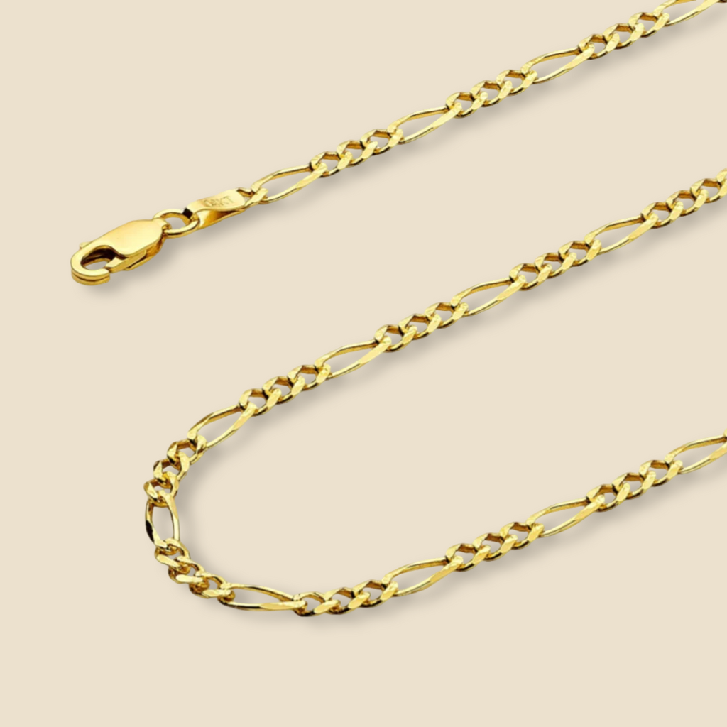 14K yellow gold 3.5mm Figaro chain necklace displayed on a plain background, showcasing its polished finish and classic 3+1 link design.