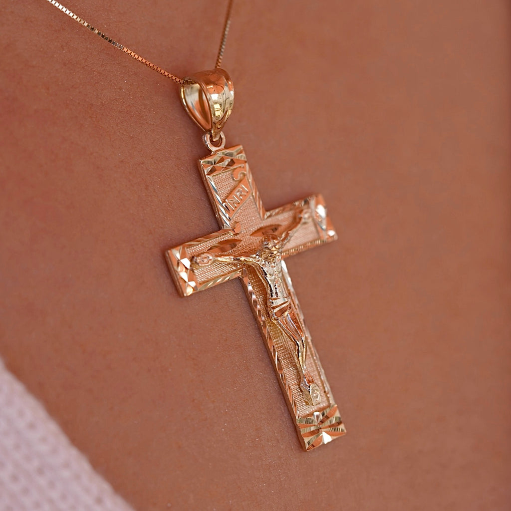 Model wearing the 14K Yellow Gold Fancy Crucifix Pendant, showcasing its intricate design and religious symbolism.
