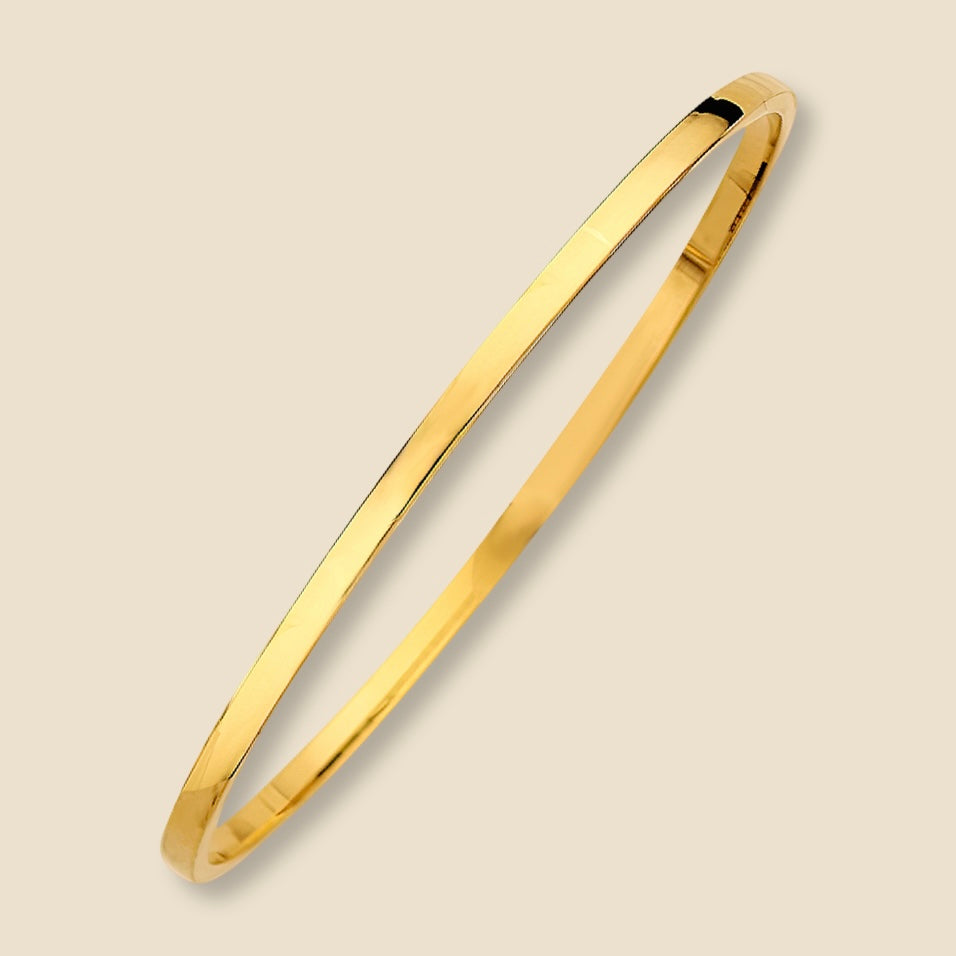 A high-resolution studio shot of a 14K yellow gold square bangle bracelet with a 3mm hollow design, photographed against a plain background to emphasize its fine polish and structured silhouette.