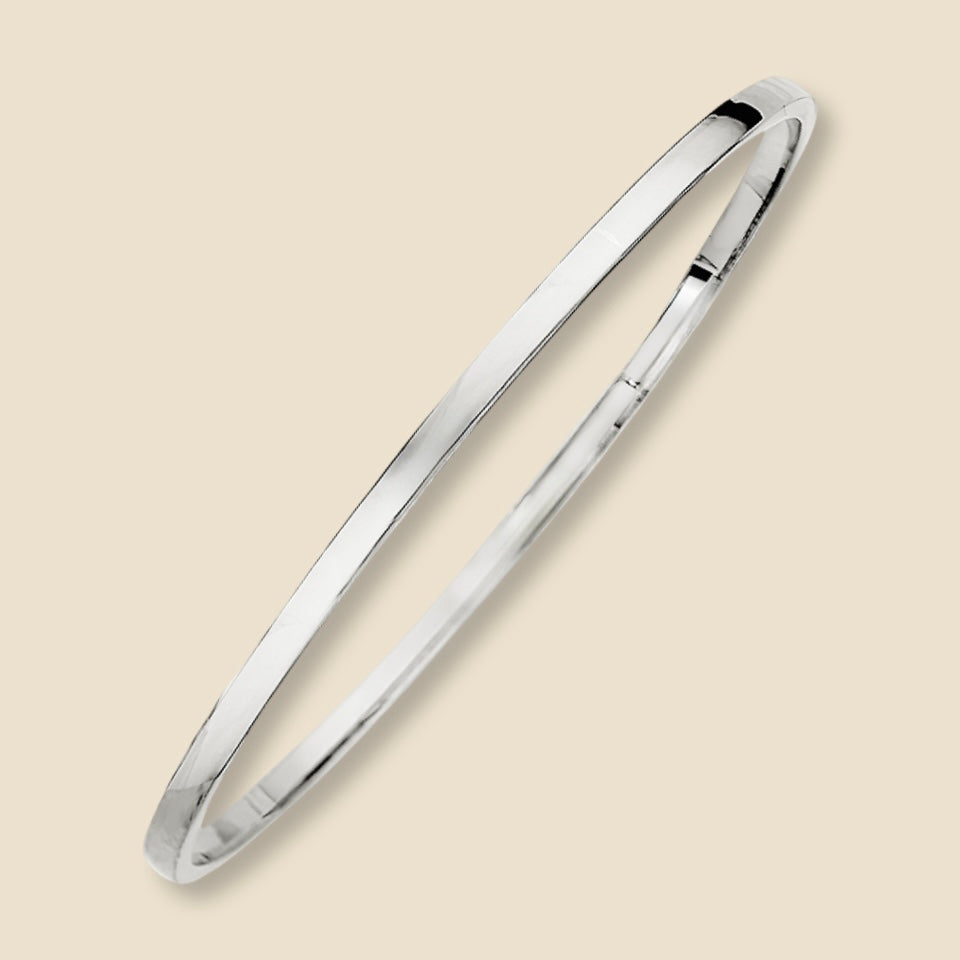 A high-resolution studio shot of a 14K white gold square bangle bracelet with a 3mm hollow design, photographed against a plain background to emphasize its fine polish and structured silhouette.