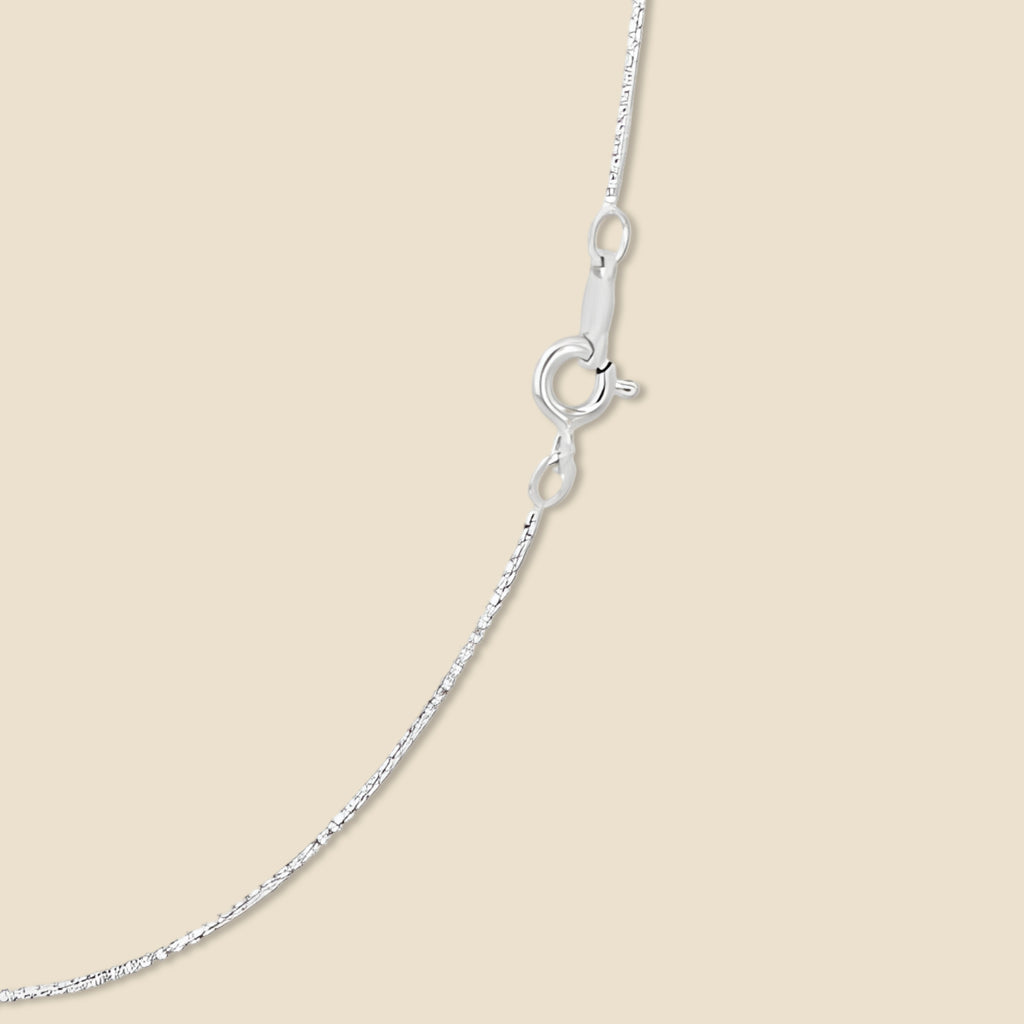14K white gold 0.5mm box chain necklace displayed on a plain background, highlighting its sleek, polished finish and fine craftsmanship.