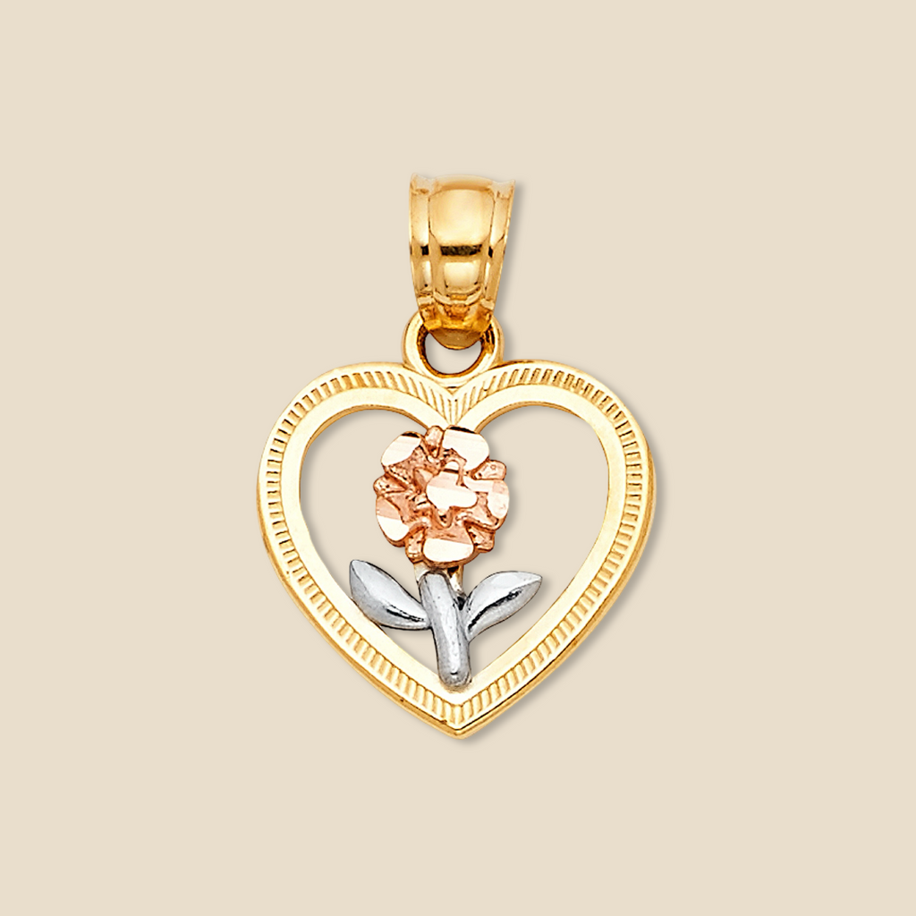 14K Tri-Color Gold Heart Flower Pendant resting on a plain background, highlighting its polished yellow, white, and rose gold floral design.