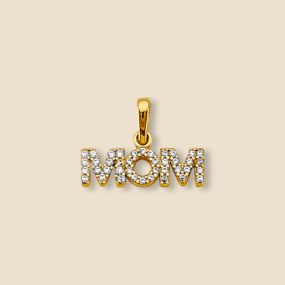 14K gold Mom pendant featuring sparkling cubic zirconia details, photographed against a plain background. The script-style design is sleek and polished, showcasing the pendant’s refined craftsmanship and elegant shine.