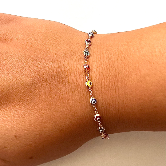Model showcasing the stunning 14K Solid Gold Evil Eye Rainbow-Style Bracelet, a colorful and meaningful accessory for every occasion.