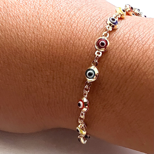 Model showcasing the stunning 14K Solid Gold Evil Eye Rainbow-Style Bracelet, a colorful and meaningful accessory for every occasion.