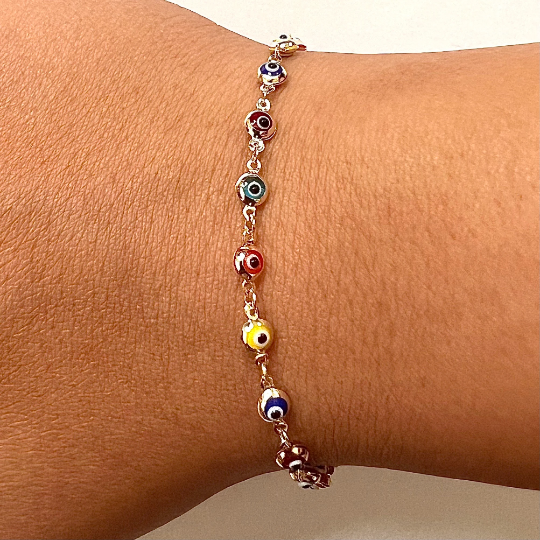Model showcasing the stunning 14K Solid Gold Evil Eye Rainbow-Style Bracelet, a colorful and meaningful accessory for every occasion.