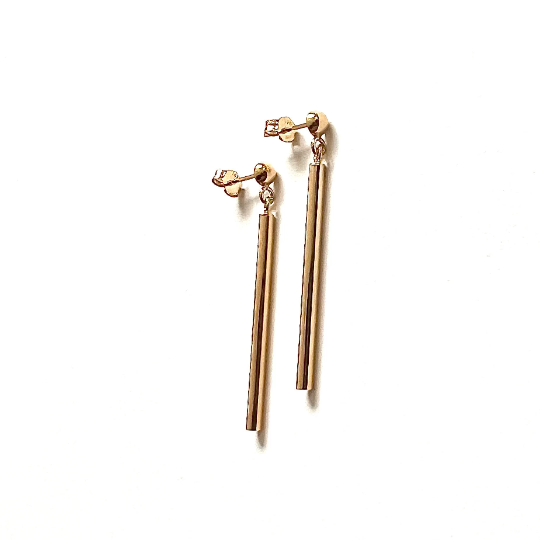 Elevate your style with our exquisite genuine gold bar dangle earrings. Handcrafted from pure 14K solid gold, these earrings emanate luxury and sophistication. The meticulously designed bars catch and reflect light, showcasing the radiant glow of authentic gold. Secured with a butterfly back, these earrings offer both elegance and comfort, making them the perfect addition to your jewelry collection.