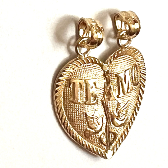 Solid gold Te Amo Breakable charm. Heart shape it has two birds on it and wrote Te Amo on it. it has a crack between two parts of heart so it can get separated and gifted to the loved one. 