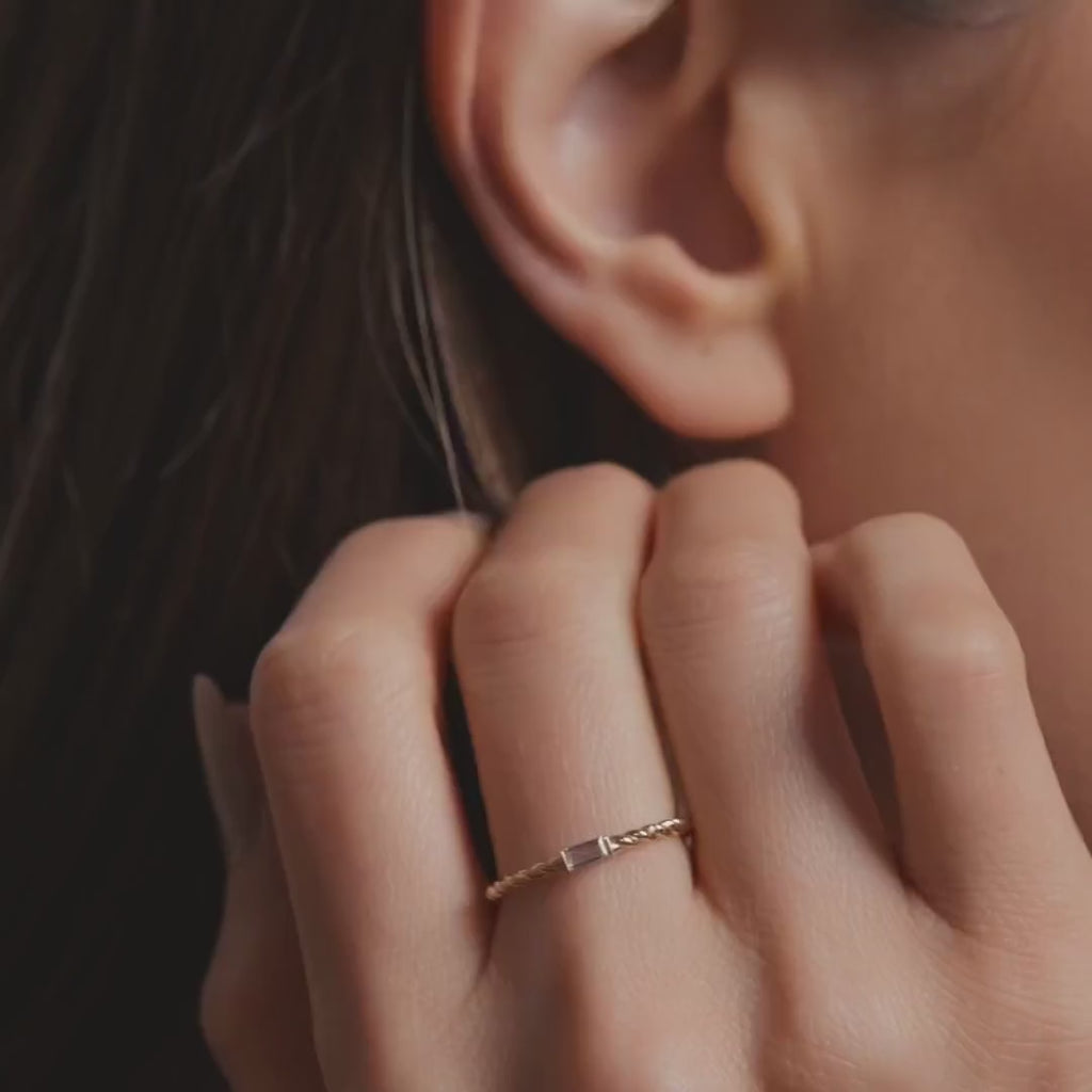 Model wearing 14K Yellow Gold Stackable CZ Ring, showcasing its dainty design and elegant sparkle on the finger.