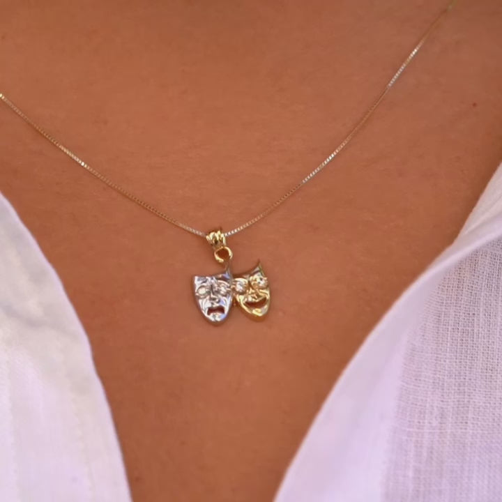 Model wearing 14K Two-Tone Solid Gold Comedy & Tragedy Charm from the right angle, highlighting cubic zirconia accents and two-tone gold design.