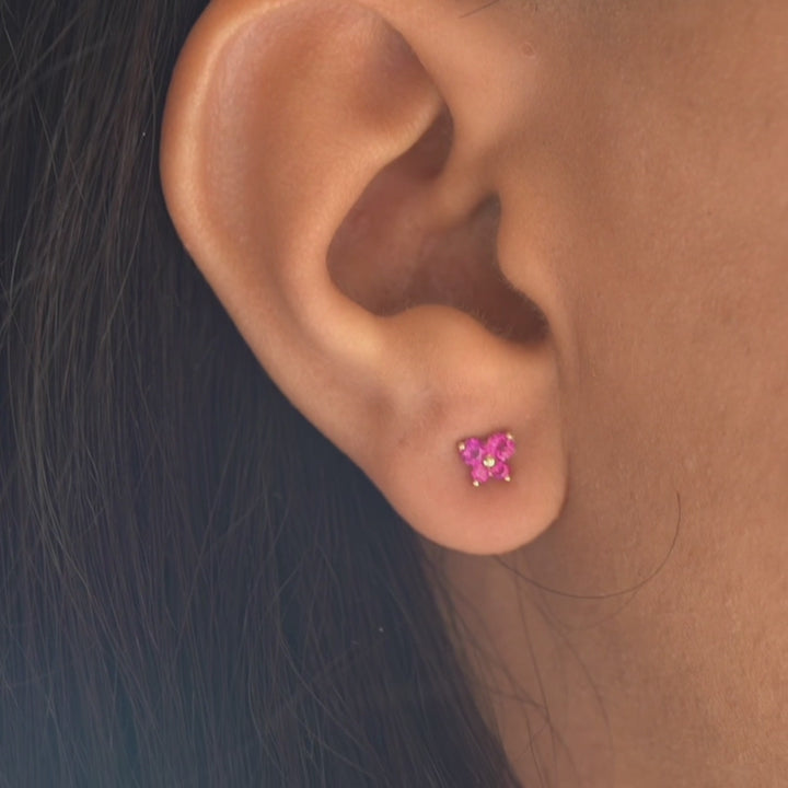 Model wearing 14K yellow gold butterfly earrings with cubic zirconia, highlighting their dainty and elegant fit.