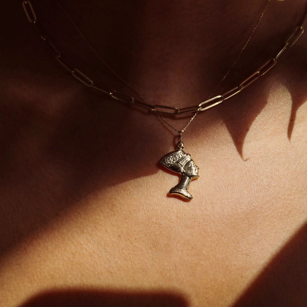 14K Real Gold Nefertiti Charm worn by a model, showcasing the elegant profile and intricate details of the Egyptian queen pendant.