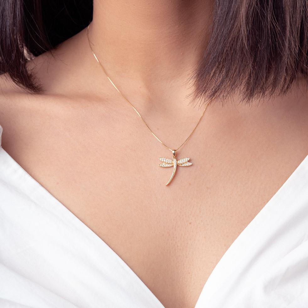 Model wearing 14K Solid Gold Dragonfly Pendant with Cubic Zirconia, front view.