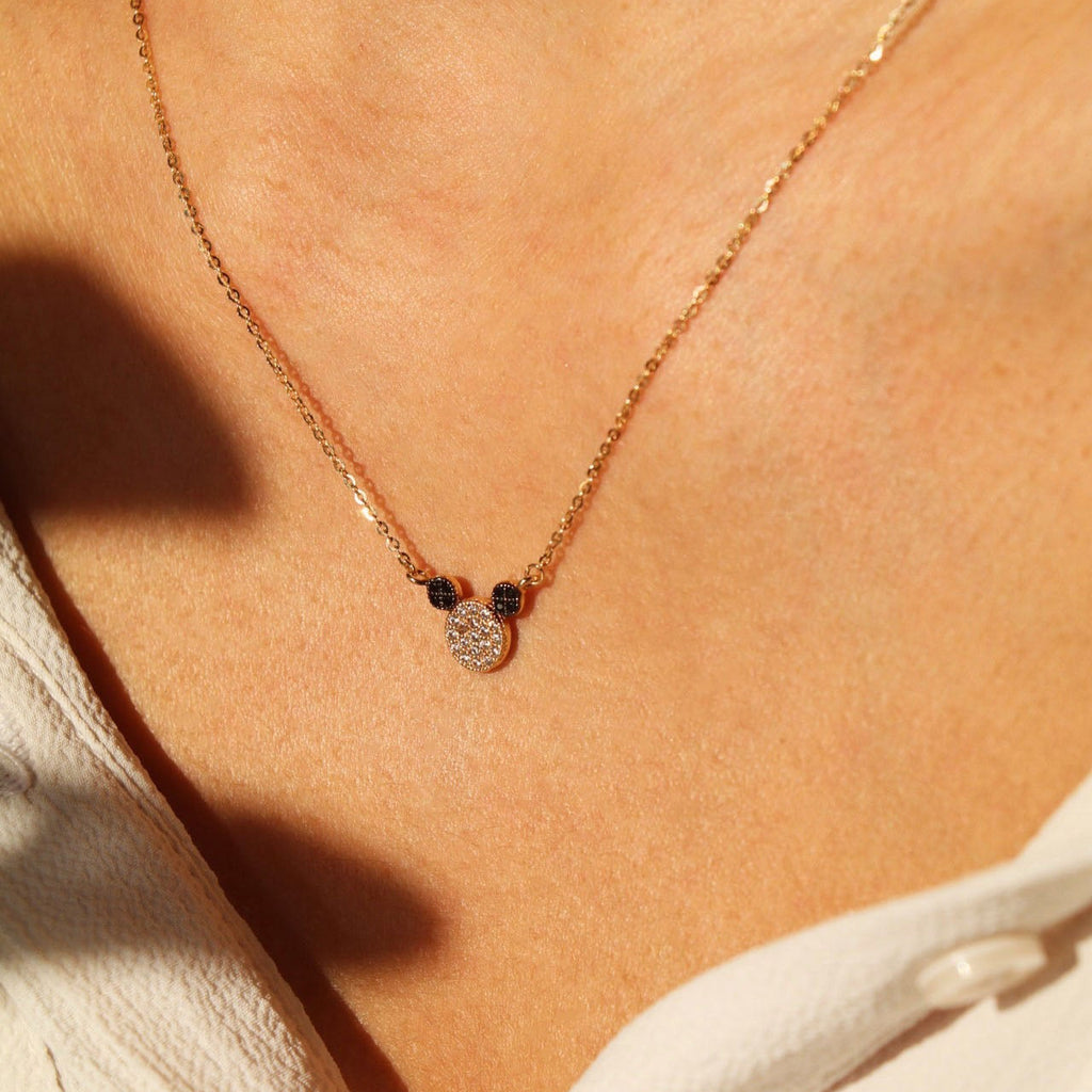 Model wearing the 14K Solid Gold Mouse Necklace, showcasing its dainty mouse pendant and elegant yellow gold chain with an adjustable 17+1 inch length.